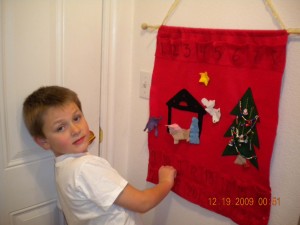Samuel and Advent Calendar Samuel opening the day's pouch in our Advent Calendar after our daily December devotional