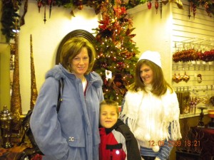 Samuel at Moden Display Elaine, Samuel, and Rachel on "Christmas Saturday," the day in December when we buy a new piece for our Nativity, go out to dinner, and then see the lights on Temple Square