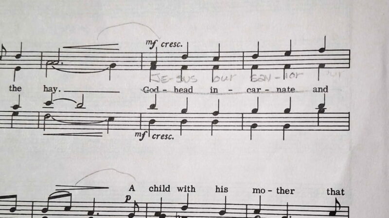 Sheet music of "Candlelight Carol" with Godhead incarnate crossed out. From an LDS music library.