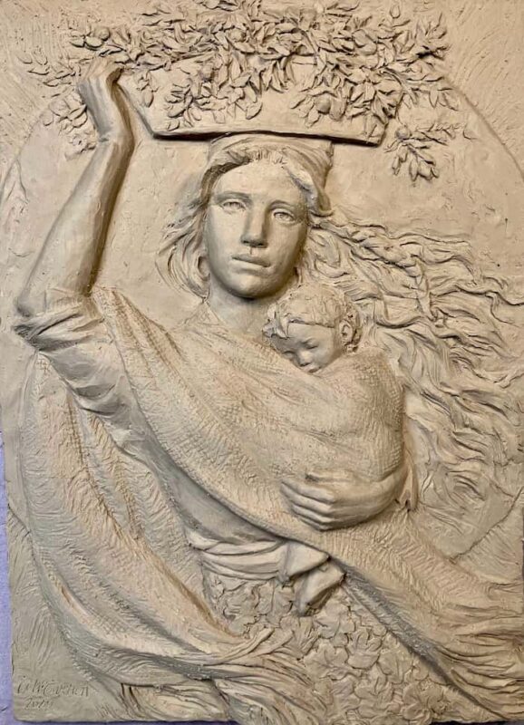 Bas relief of Eve with a child.