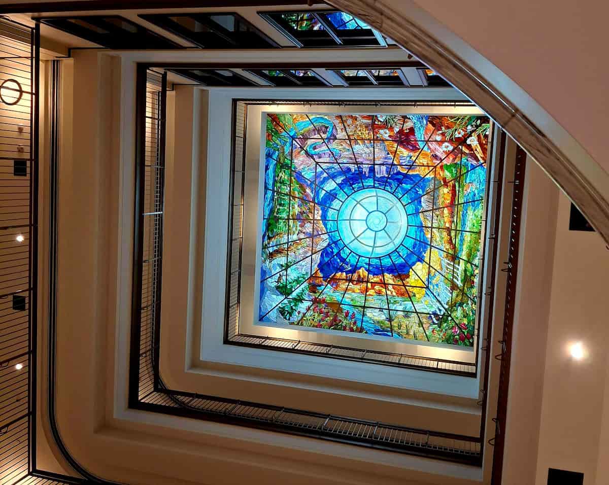 A stained glass window by Holdman Studios depicting Utah landmarks in the Museum of Utah