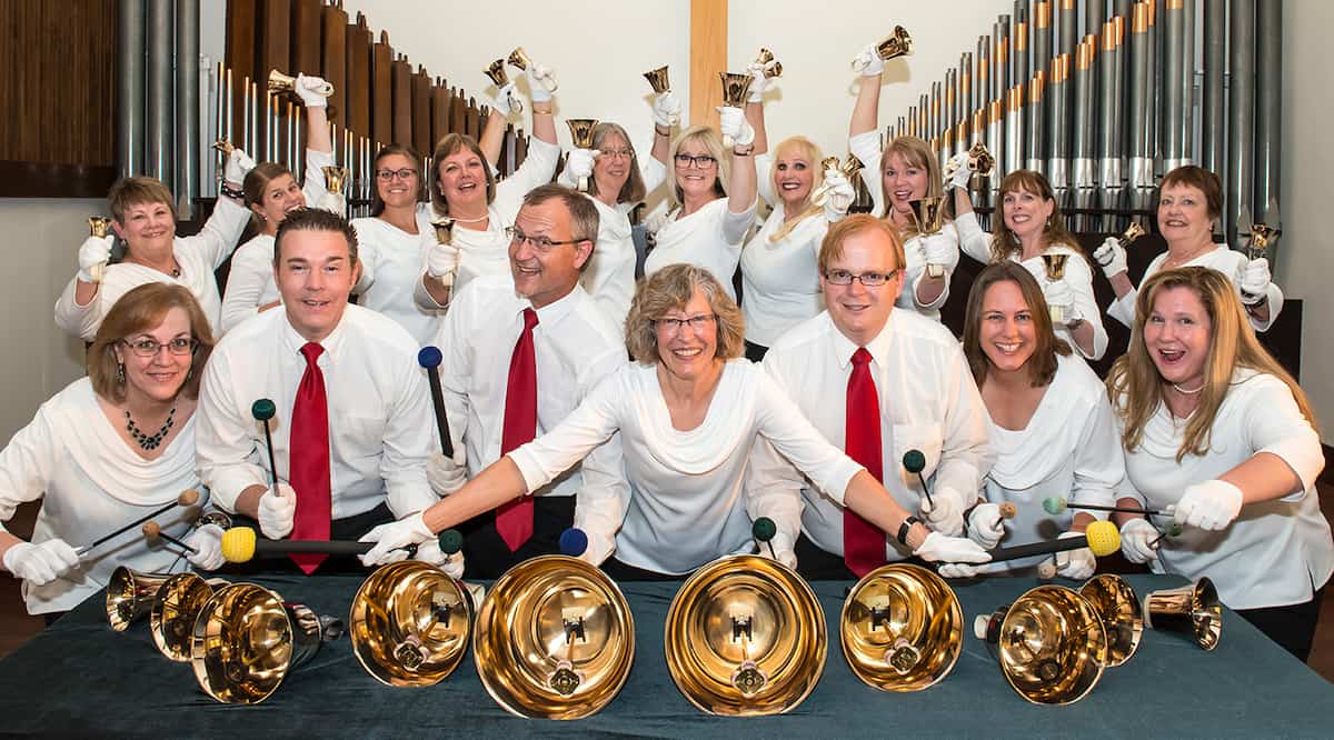 A photograph of a Presbyterian handbell ensemble being silly.